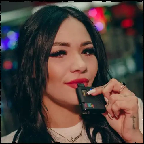 A girl using a vape